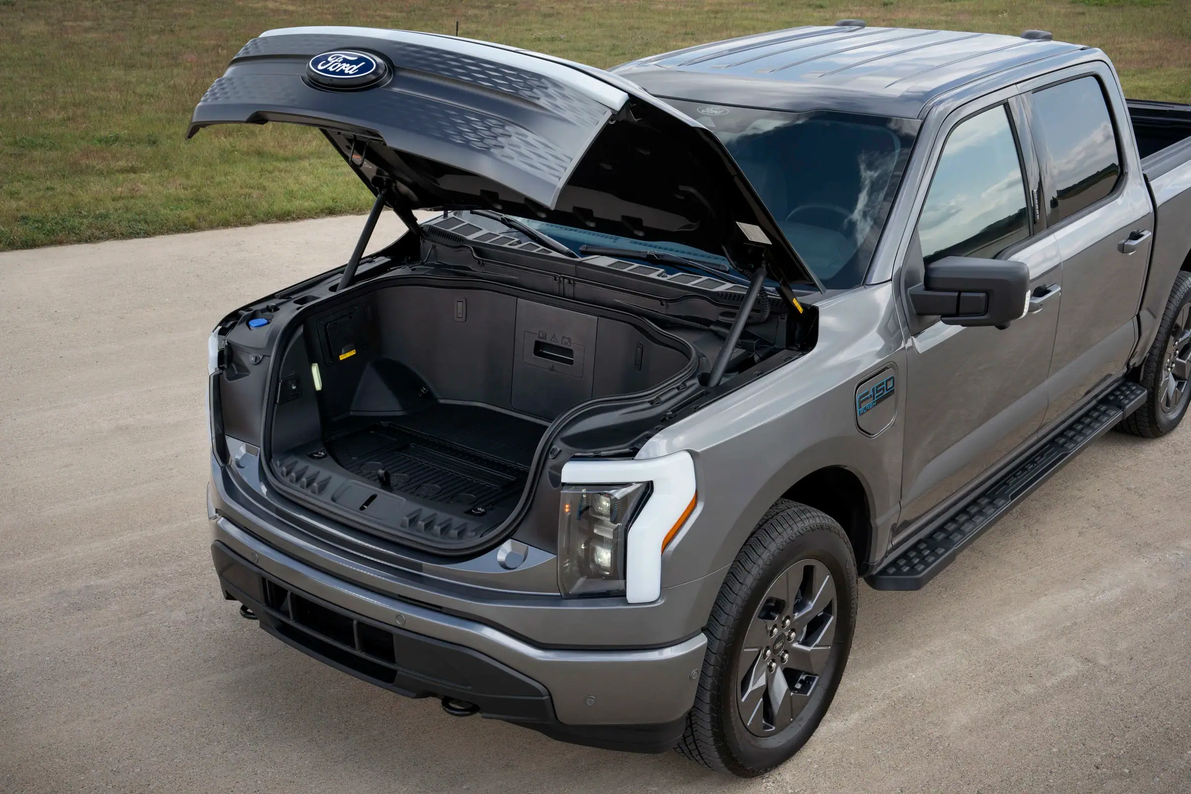 2025 Ford F-150 Lightning with hood open showing the Mega Power Frunk cargo storage