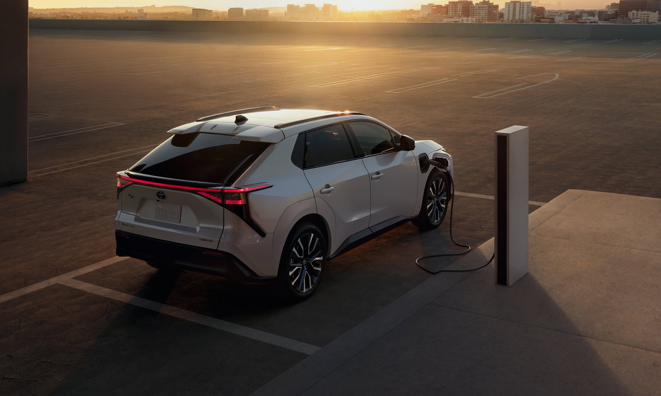 2026 Toyota bZ limited external rear view pluged into charger
