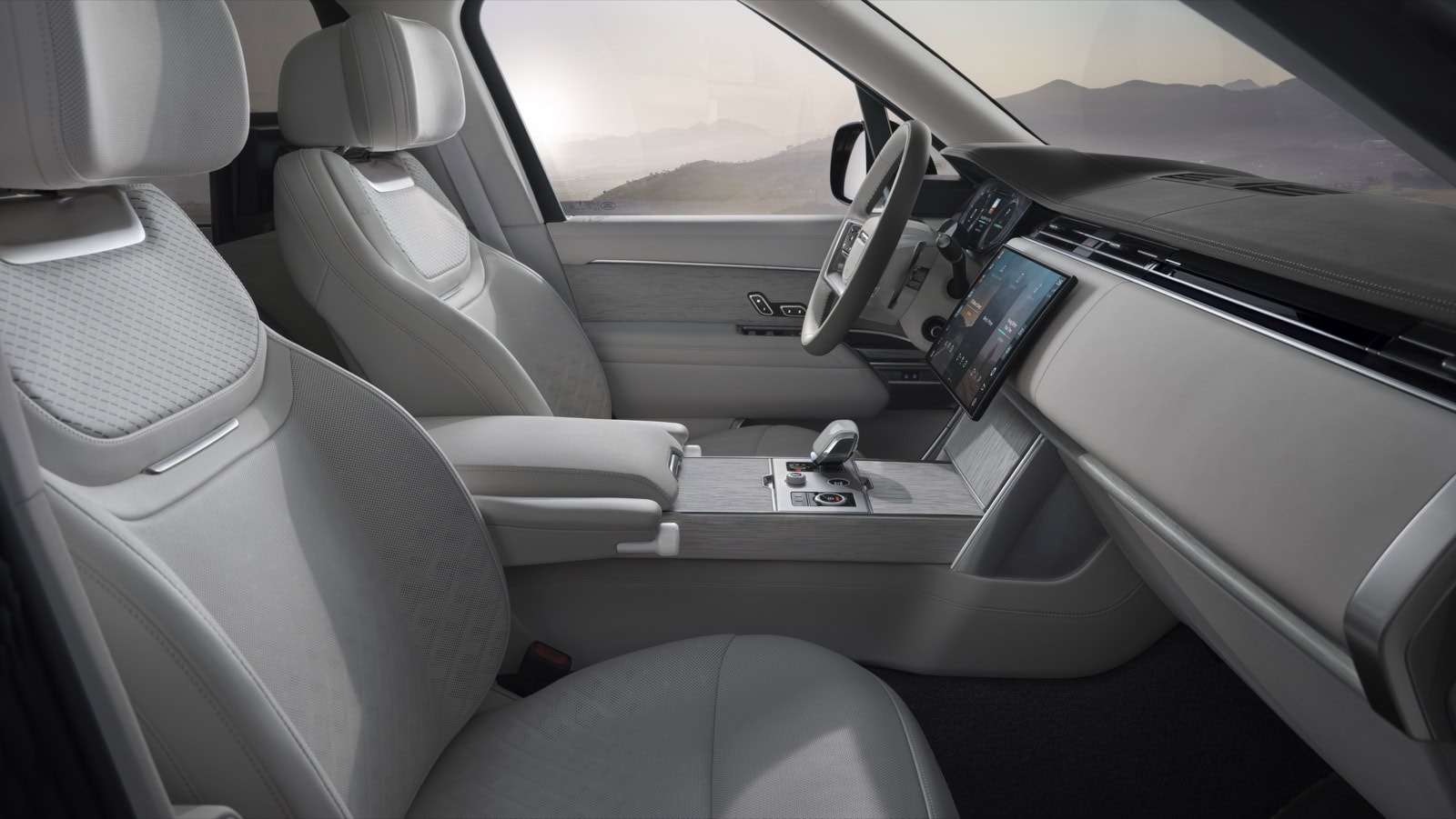 2027 Range Rover Electric cabin showing front seats, dashboard, and center console