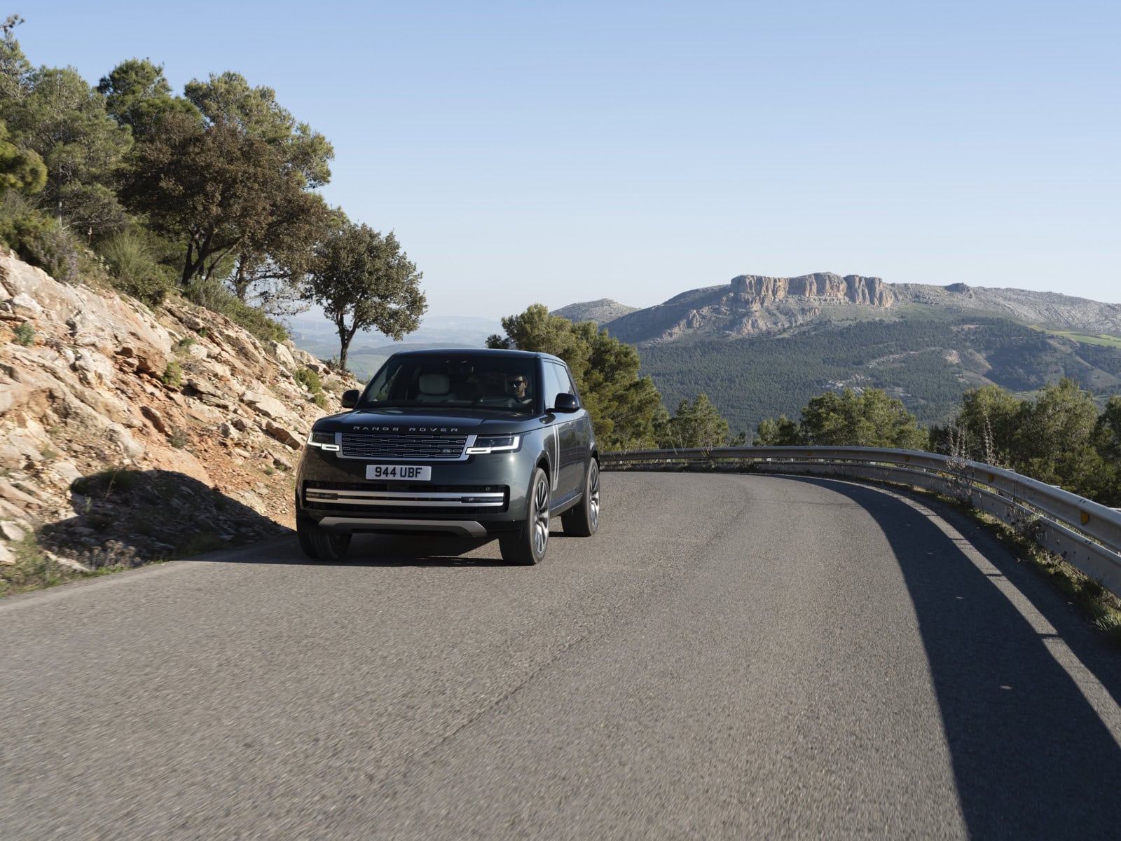2027 Range Rover Electric driving on a mountain road