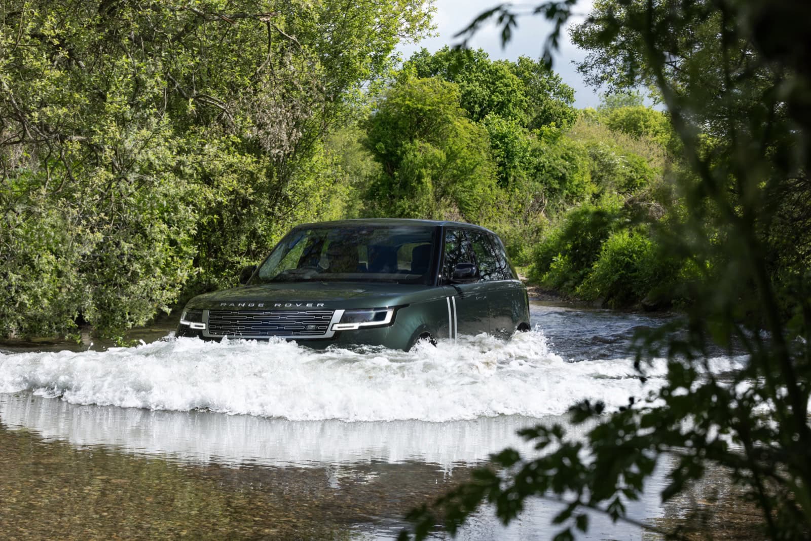 2027 Range Rover Electric wading through water