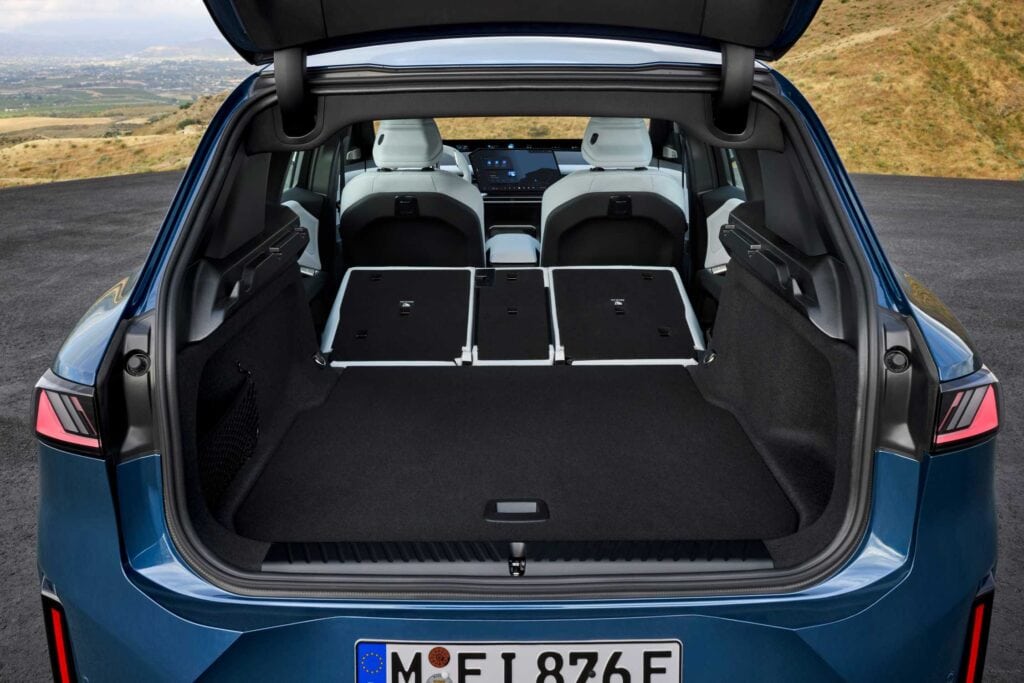 BMW iX3 50 xDrive cargo area with the rear seatbacks folded, European model shown