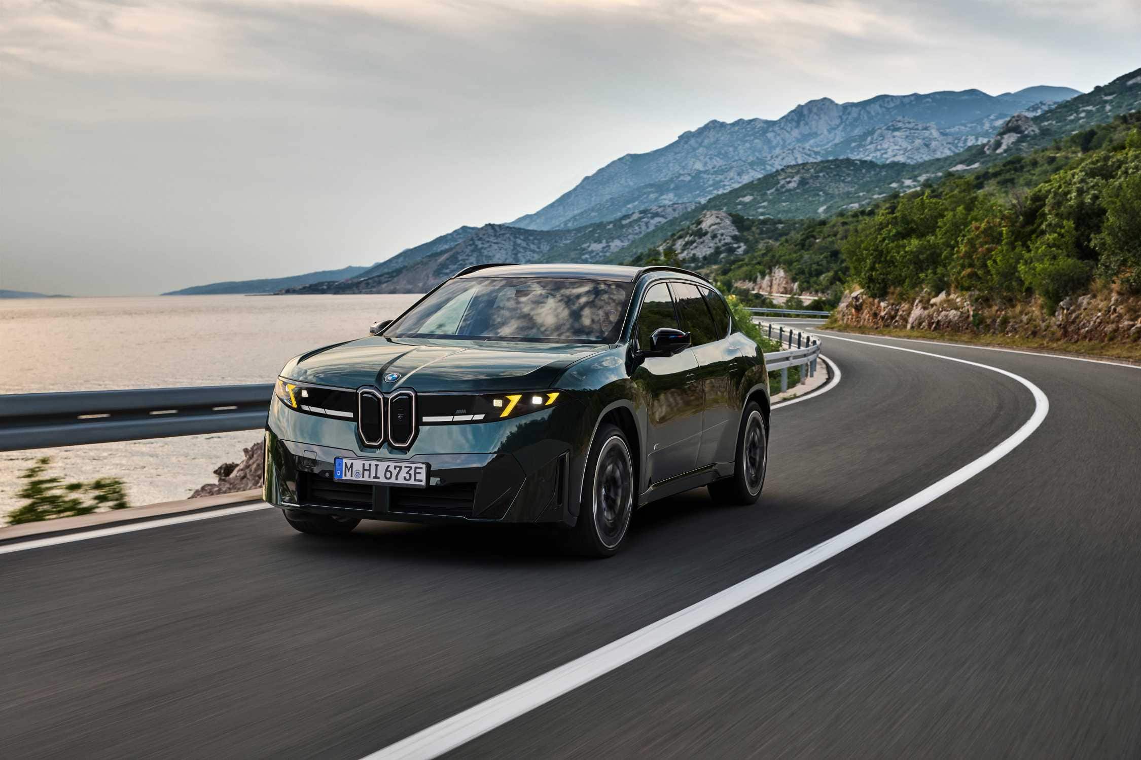 BMW iX3 M60 xDrive in dark green with the optional M Yellow Lights