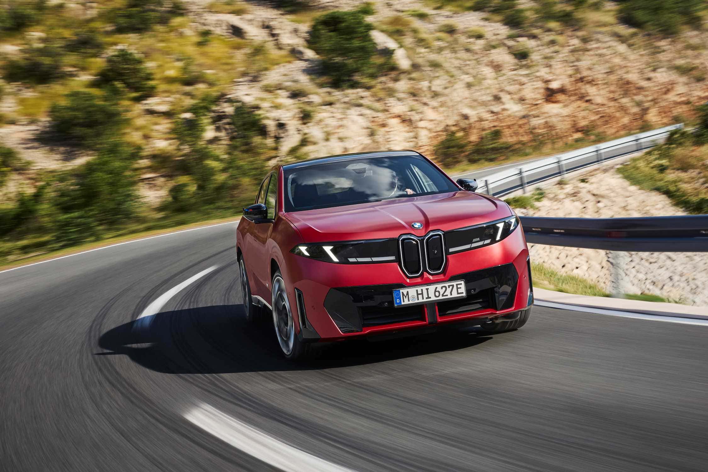 BMW iX4 M60 xDrive in red, European model shown