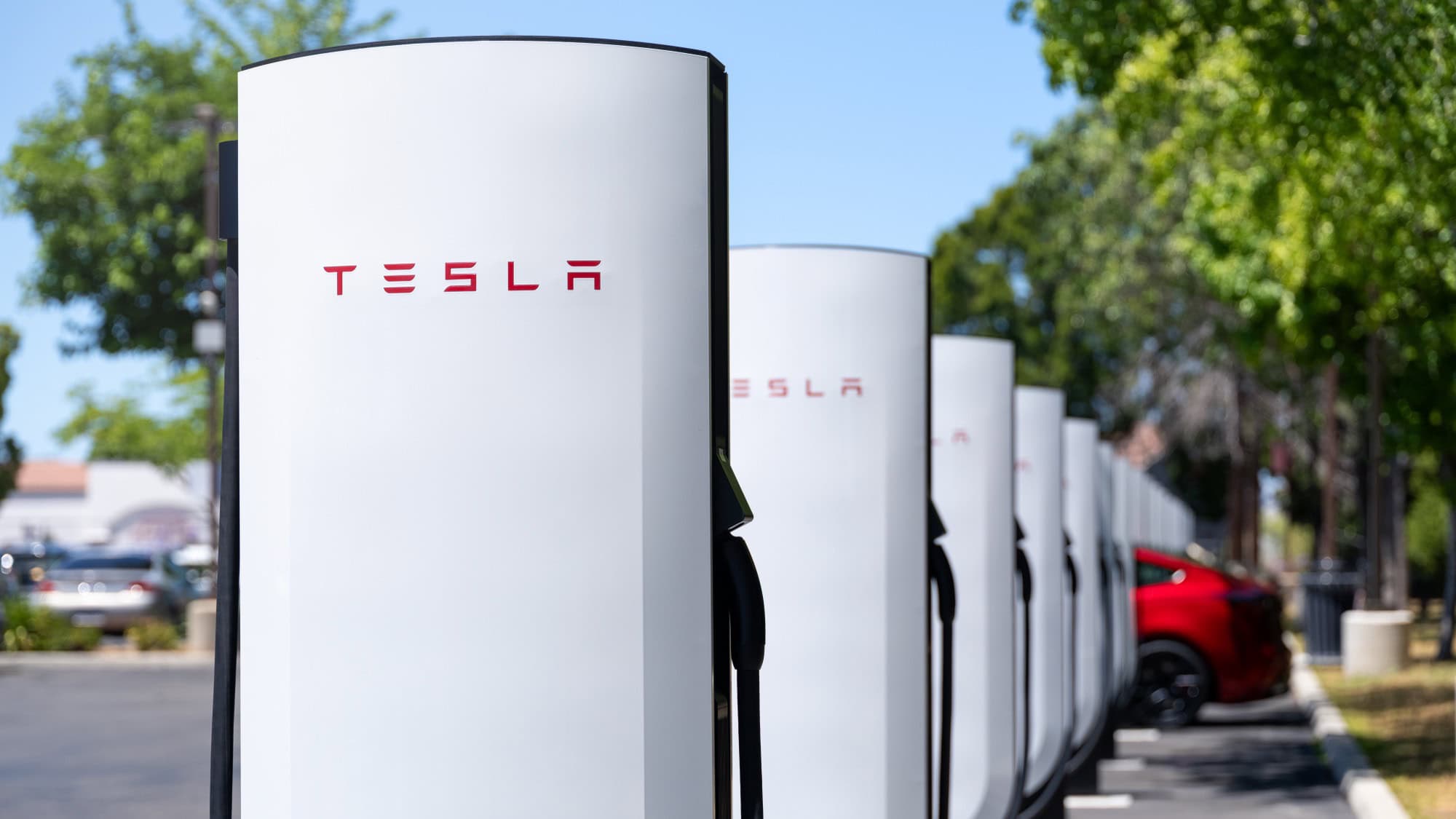 Close up of a Tesla V4 Supercharger stall with its charging cable