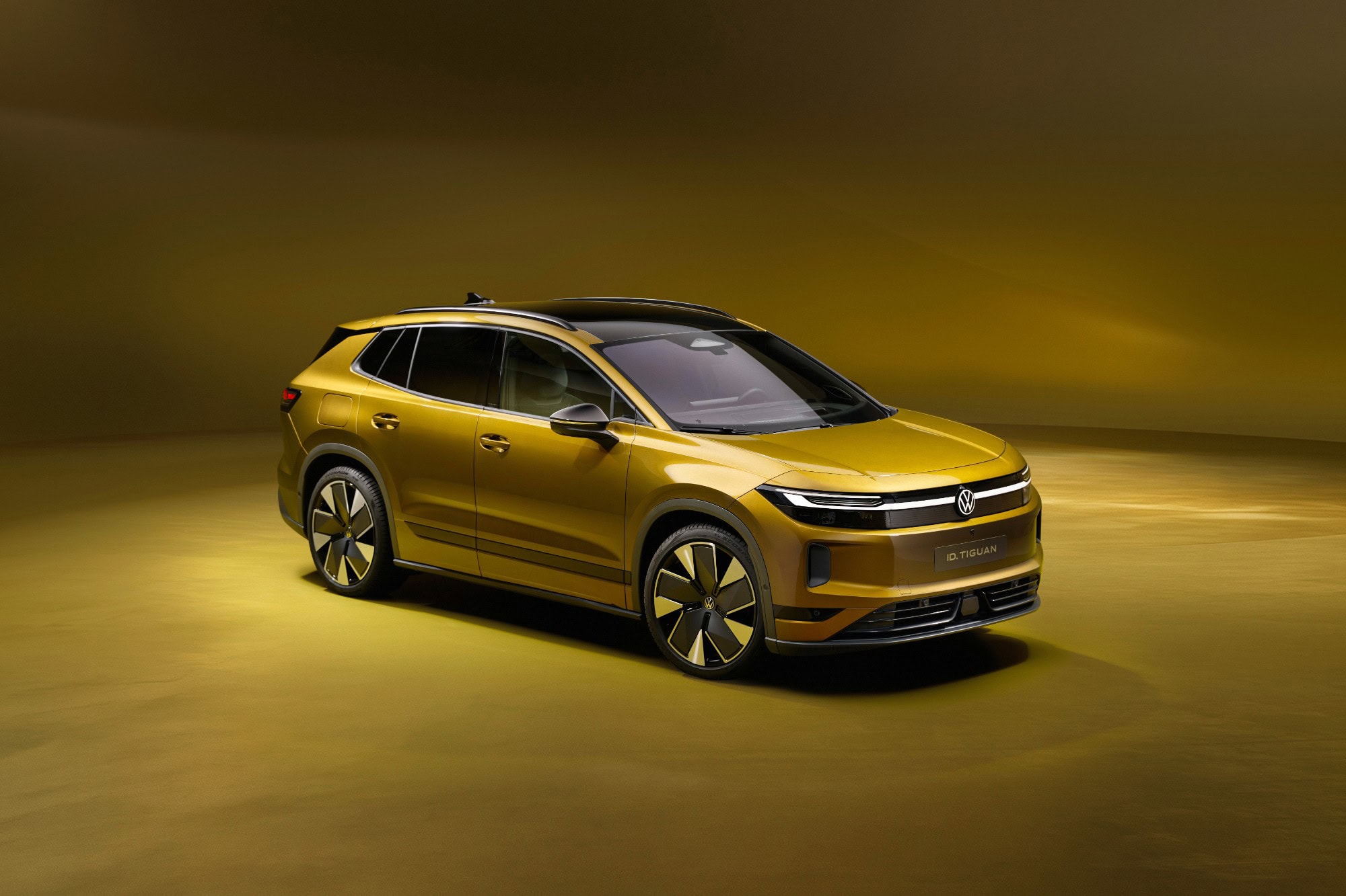 Volkswagen ID. Tiguan in Olive Bronze, front three quarter view, studio