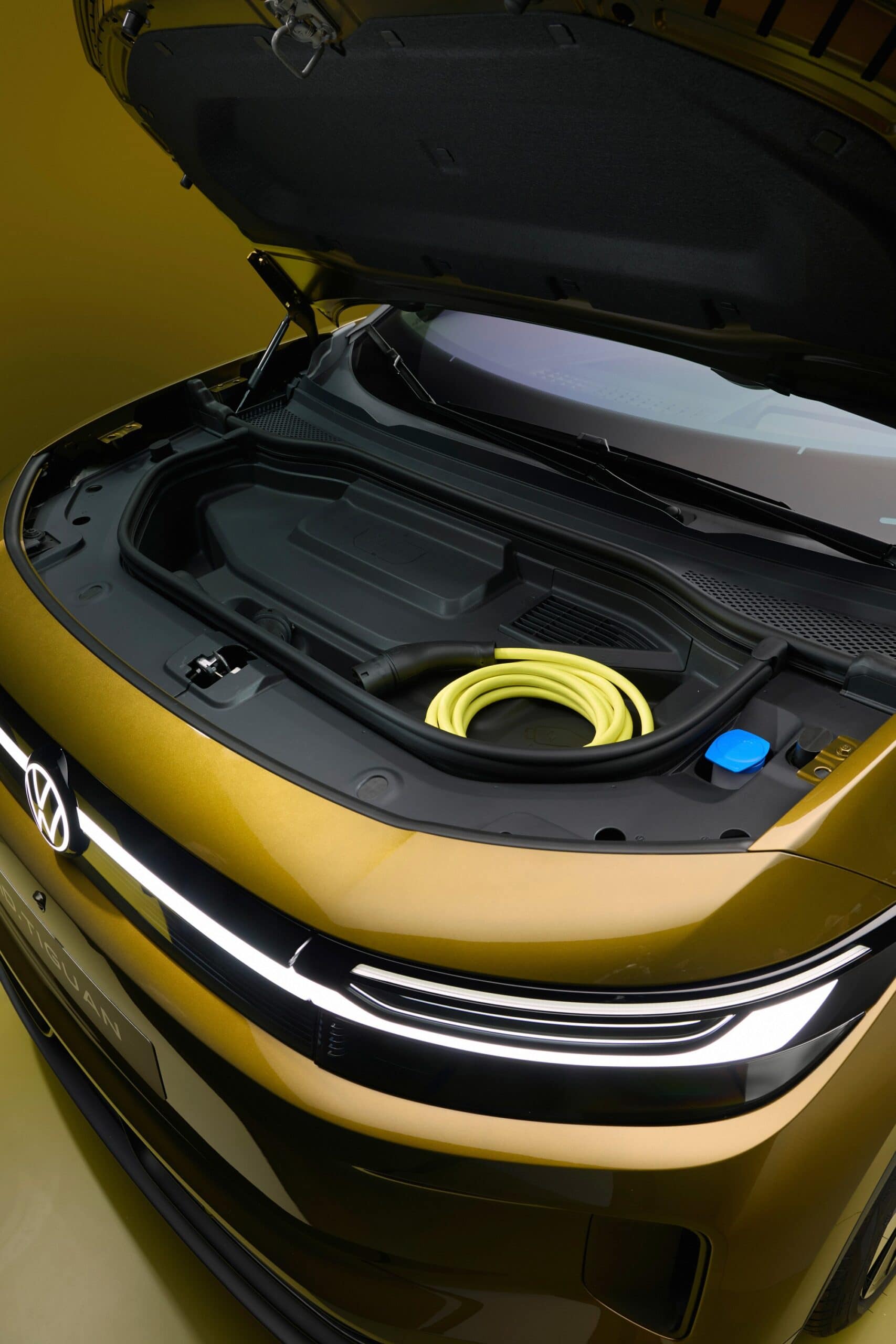 Volkswagen ID. Tiguan front trunk holding the charging cable